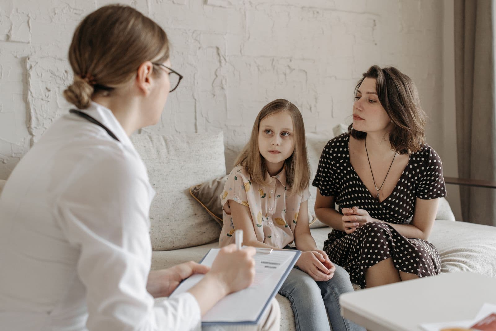 A mother in a consultation with her child's doctor